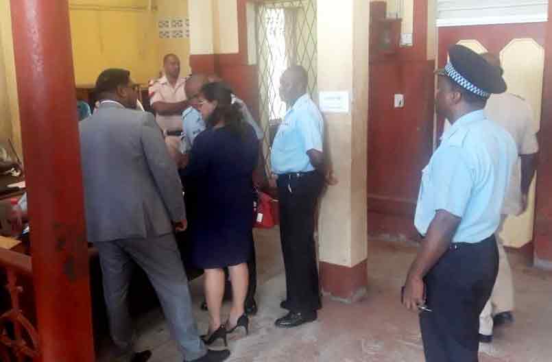 Former Minister of Housing , Irfaan Ali (left) at the Georgetown Magistrate's Court on Wednesday.