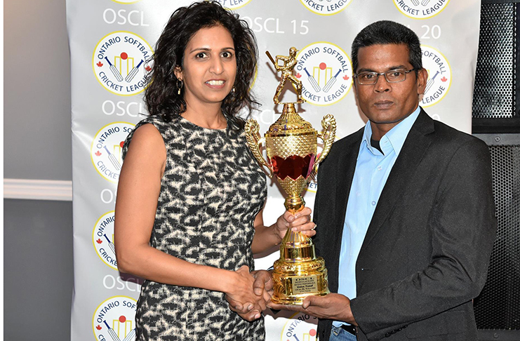 Uniss Yusuf collects one of his awards from Jas Mathura, wife of OSCl vice-president Terry Mathura. Yusuf had an incredible season, scoring 509 runs, including a top score of 116 not out. He was also the MVP for the winning Jaguars team in the annual All Stars feature.