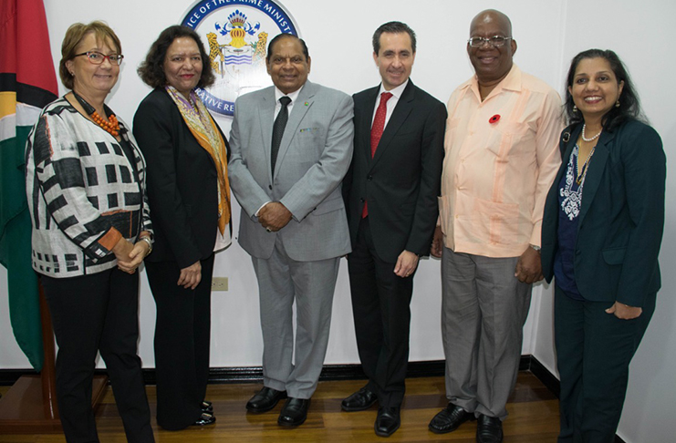 Prime Minister Moses Nagamooto and Finance Minister Winston Jordan with members of the World Bank team (DPI photo)