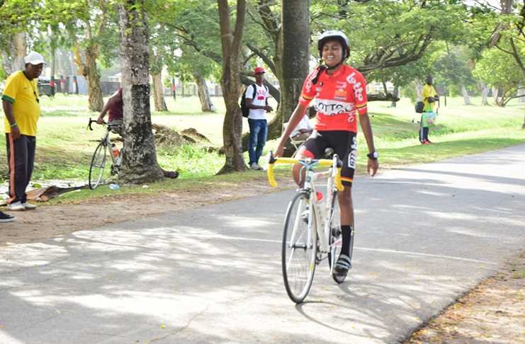 District 6’s (Corentyne) Shabina Ramoo crosses the finish line to cop Gold in the 2000 Metres Girls U-16 race to help her district retain their Cycling title.