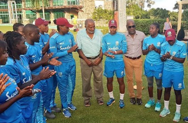 Sir Vivian Richards (third from right) has the attention of the West Indies Women, during a training session. CWI ambassador, Sir Andy Roberts (fifth from right), is also present. (Photo courtesy CWI Media)