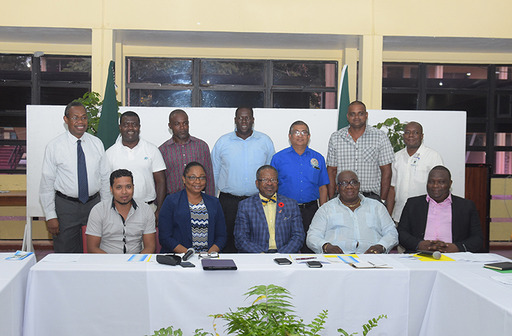 Vice Chancellor of the University of Guyana (UG) Professor Ivelaw Griffith (at centre, seated), flanked by representatives of the various local technical institutions which signed on to the HECEM (Samuel Maughn photo)