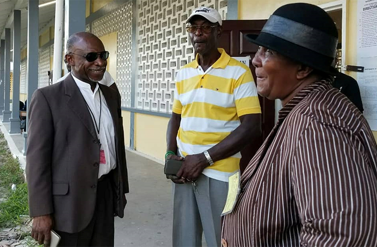 Minister of Foreign Affairs, Carl Greenidge interacts with residents