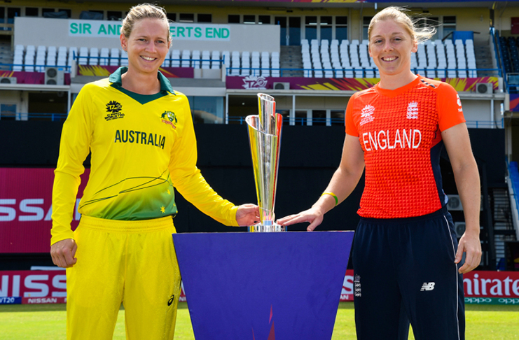 Meg Lanning and Heather Knight pose with the 2018 Women's World T20 trophy, North Sound, November 23, 2018.  (AFP/Getty)