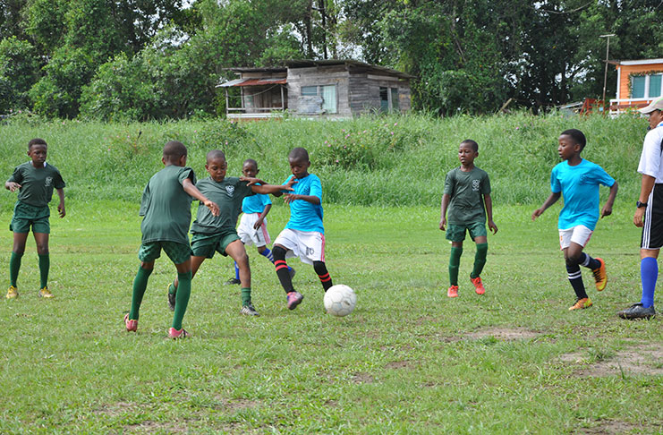Action in the Timehri Panthers (green) and Diamond Upsetters match yesterday at the Diamond Community Centre Ground.