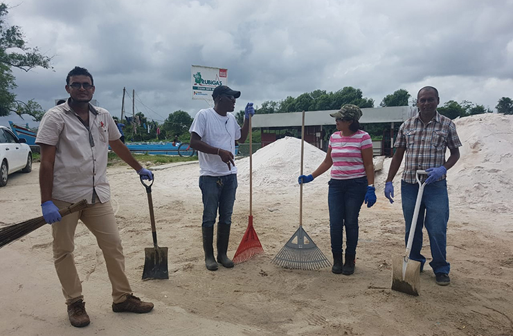 Volunteers assisting in the cleaning up