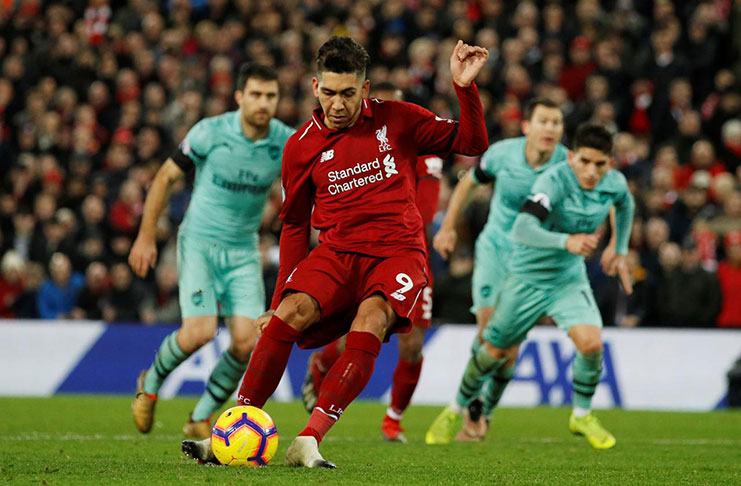 Liverpool's Roberto Firmino scores their fifth goal from the penalty spot to complete his hat-trick. (REUTERS/Phil Noble)