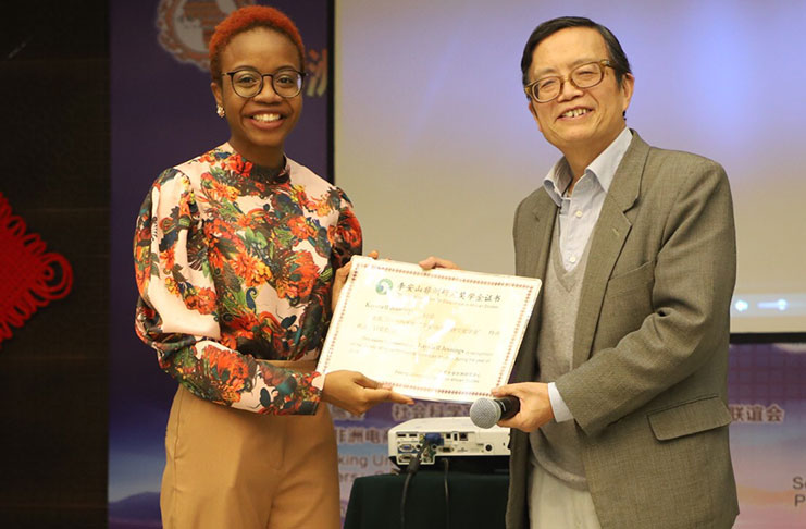 Kayshell collecting the Li An Shan Award for Excellence in African Studies