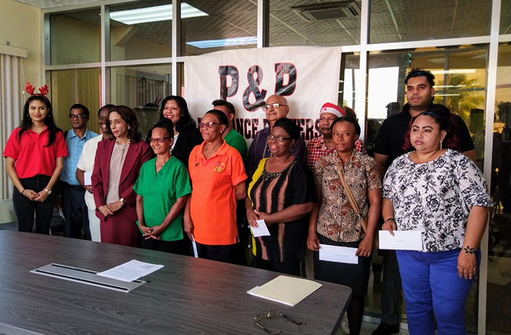 Representatives of the 12 organisations that received donations this year with P&P executives, Vikash Panday (extreme right, back row) and Vijaya Panday (extreme left front row)