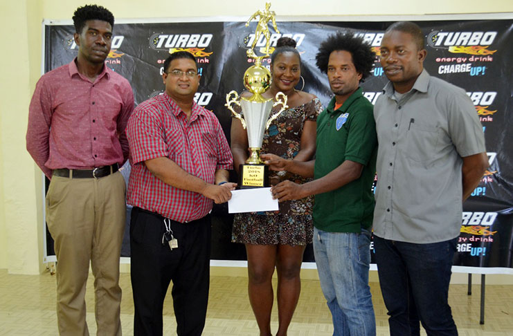 Nigel Denny collects Northern Rangers Trophy from GBI’s Marketing coordinator Raymond Govinda in the presence of Jacquline Boodie (centre) and Petra executives Mark Alleyne (extreme right) and Sean Embrack (extreme right).