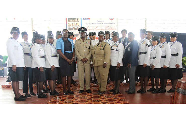 (Centre) Commissioner of Police Leslie James flanked by Deputy Commissioner Maxine Graham and foreign delegate, Assistant Commissioner Patsy Joseph along with female ranks from Guyana Association of Women Police