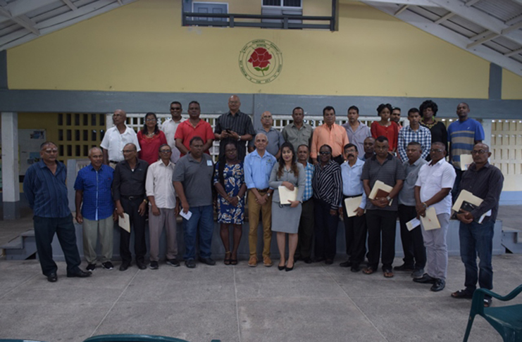 Minister of Communities, Ronald Bulkan [centre] along with Regional Executive Officer (REO) of Region Three Denis Jaikaran [back row sixth from left]; Regional Information Officer Ganesh Mahipaul [back row third from left] and the newly sworn-in NDC chairs and vice-chairs