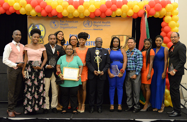 Top management of the Guyana Chronicle including General Manager (ag) Donna Todd and Editor-in-Chief, Nigel Williams along
with the winners of this year’s PAHO Media Awards and other reporters pose for a photograph following the ceremony held at
the Guyana Marriott Hotel (Delano Williams photo)