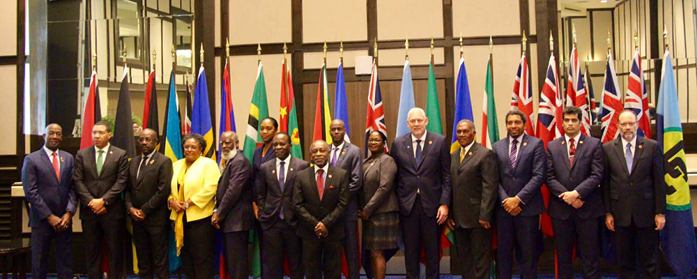Heads of Government and delegations pose at the summit