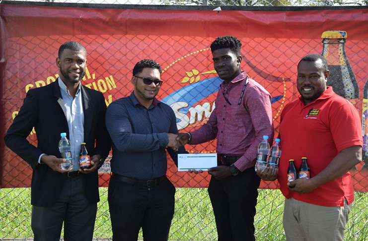 From left, Errol Nelson, Icool brand coordinator Fharis Mohamed, Petra’s Mark Alleyne and Troy Mendonca during the simple presentation of sponsorship at the MOE ground yesterday.
