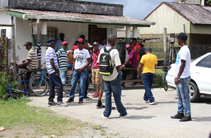 Retrenched workers wait to collect their benefits