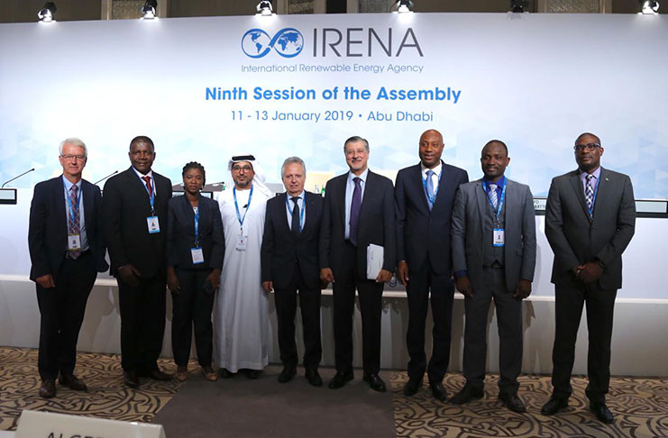Minister of Public Infrastructure , David Patterson (right) with other officials at the Ninth Session of the IRENA Assembly in the United Arab Emirates (UAE) (Photo credit: IRENA)