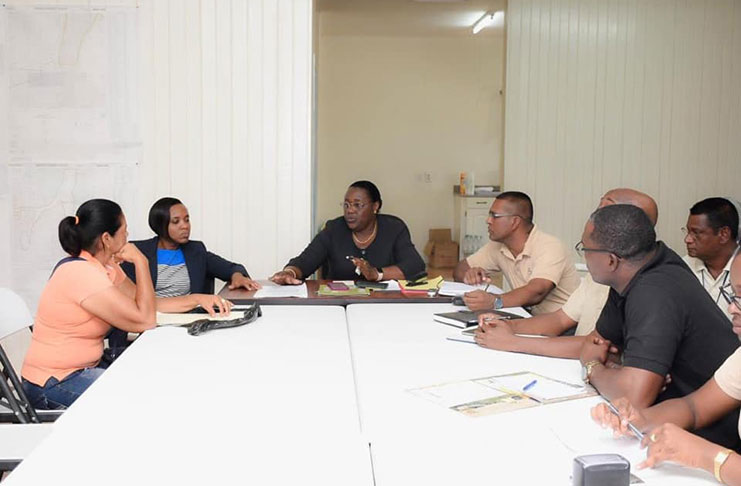 Minister within the Ministry of Natural resources Simona Broomes and a team from the Guyana Geology and Mines Commission engaging miners at Bartica Region Seven