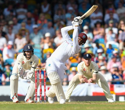 Left-handed stroke-maker Shimron Hetmyer hits out during his unbeaten 56 on the opening day of the first Test against England at Kensington Oval. (CWI photo)