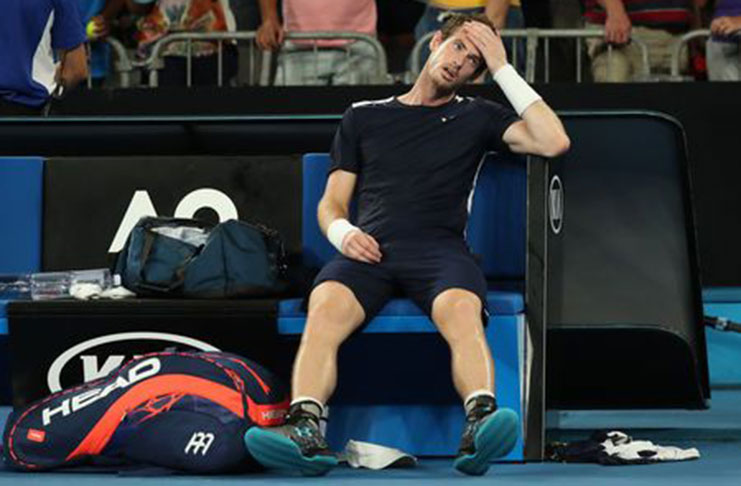 Britain's Andy Murray looks dejected after loosing the match against Spain's Roberto Bautista Agut. REUTERS/Lucy Nicholson