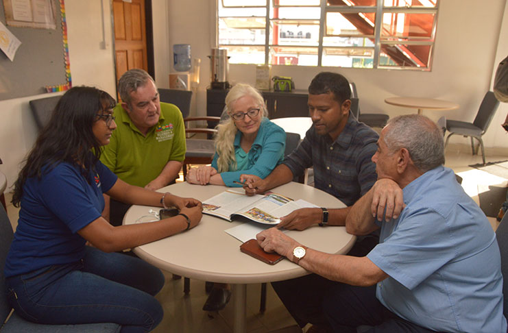 Nations Director, Dr Brian O’ Toole (second left), Full-Circle Learning President, Dr Teresa Langness (third left) and Farzin Rahmani of Gambian Gems (right) during an information-sharing session with students (Adrian Narine)