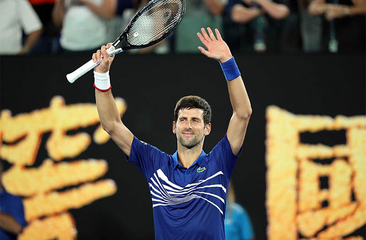 Serbia's Novak Djokovic celebrates after winning the match against France's Jo-Wilfried Tsonga. (REUTERS/Lucy Nicholson)