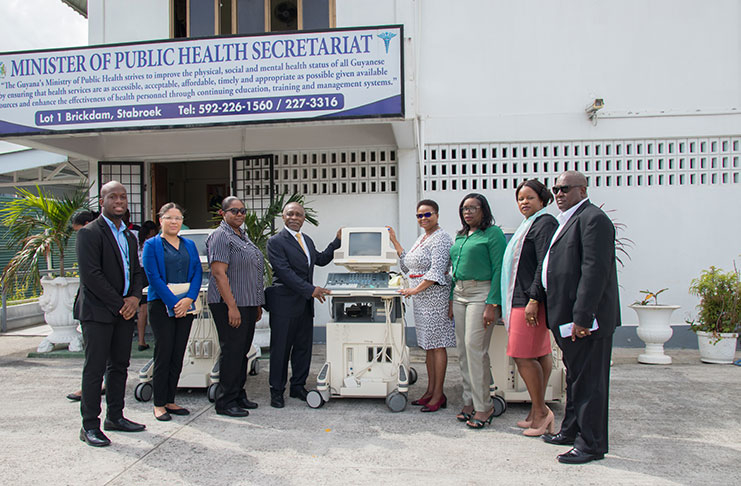Minister Volda Lawrence and team accept the donation of three ultrasound machines by Minister Carl Greenidge on behalf of the donors on Friday