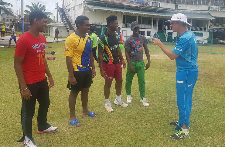 CWI Under-19 coach Graeme West makes a point to Sachin Singh while other selectees, Kevlon Anderson, Kelvin Umroa and Ashmead Nedd, look on. (Rajiv Bisnauth photo)