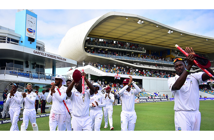Windies celebrate their 381-run win over England in the first Test at Kensington Oval.