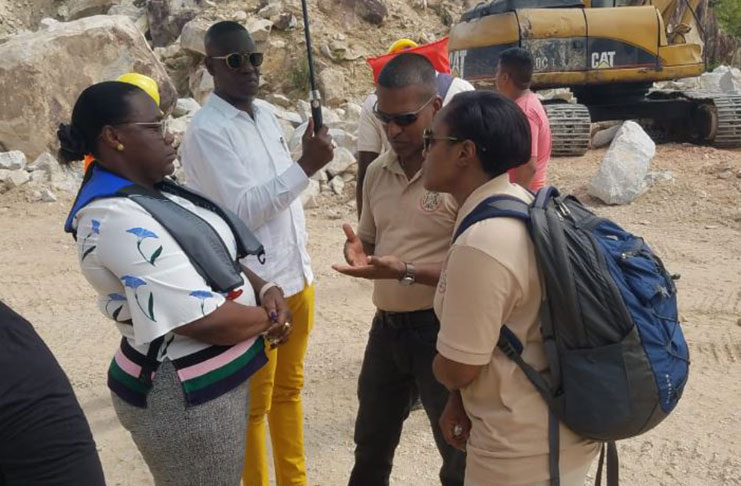 Minister within the Ministry of Natural Resources Simona Broomes speaking with officials from the Guyana Geology and Mines Commission at the Durban Quarries in Region Seven