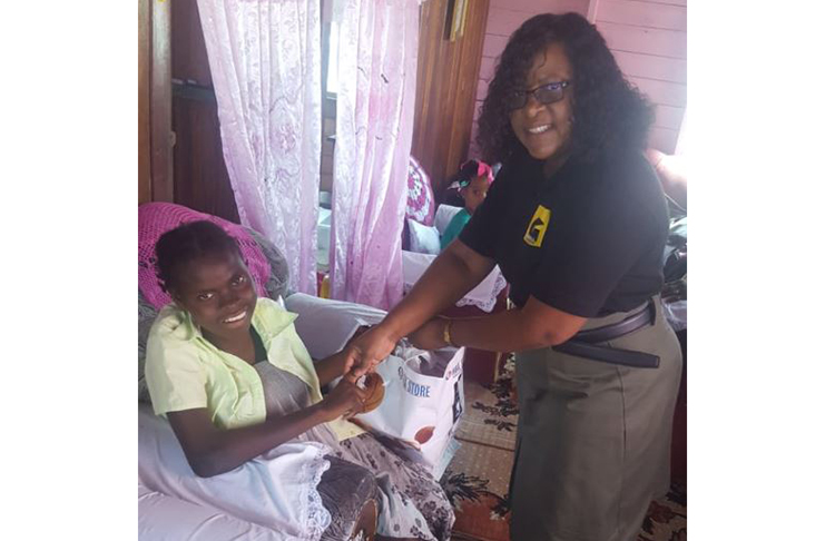 Some of the persons who received hampers and other supplies from Minister within the Ministry of Public Health, Dr Karen Cummings