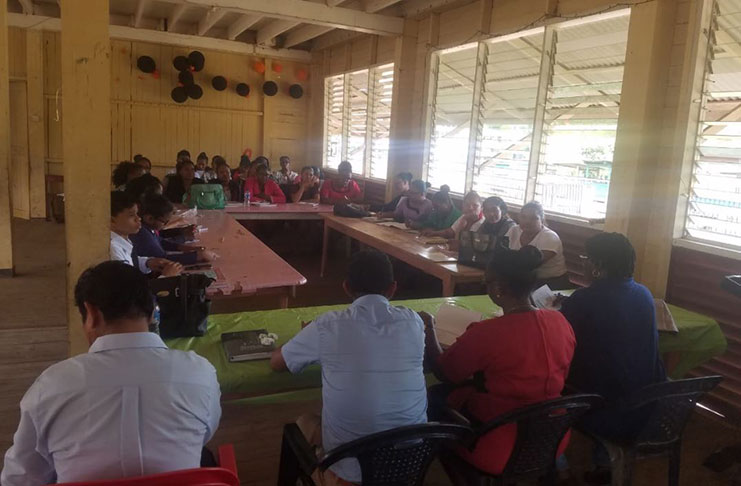 Teachers and parents during their meeting on Monday with senior education officials
