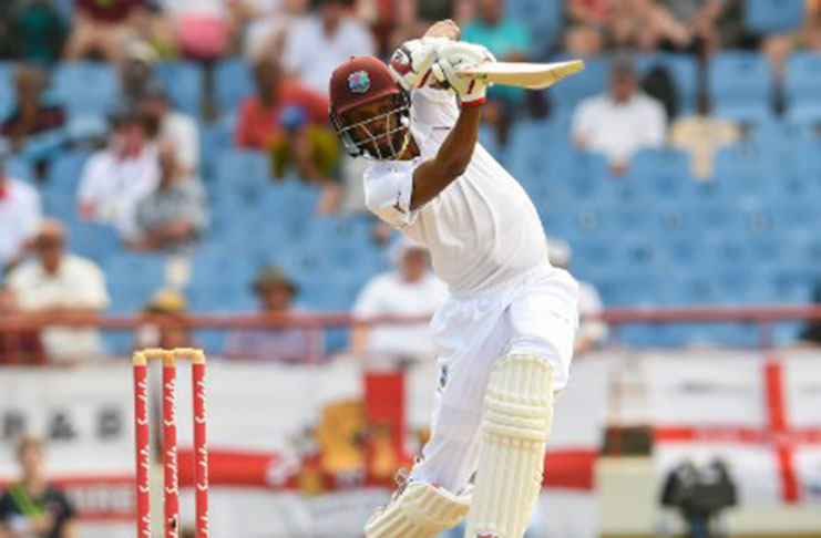 Roston Chase drives during his century against England on Tuesday.