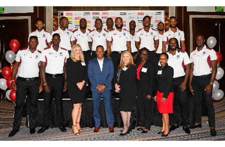 West Indies one-day team pose with officials of Colonial Group International.