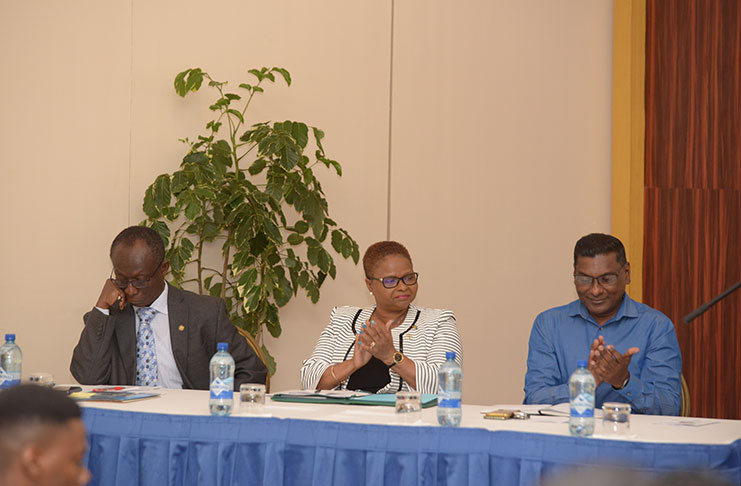At the head table, from left,  PAHO-WHO Country Representative, Dr. William Adu-Krow; Public Health Minister Volda Lawrence and CMO Dr. Shamdeo Persaud