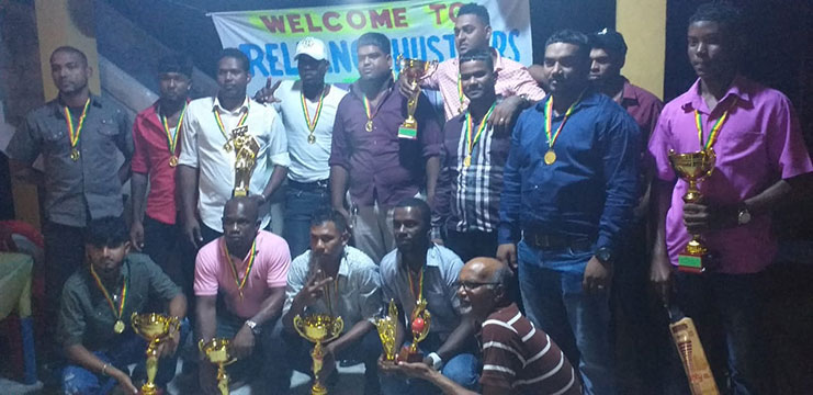 Reliance Hustlers members proudly pose with their memorabilia at Saturday’s evening ceremony.