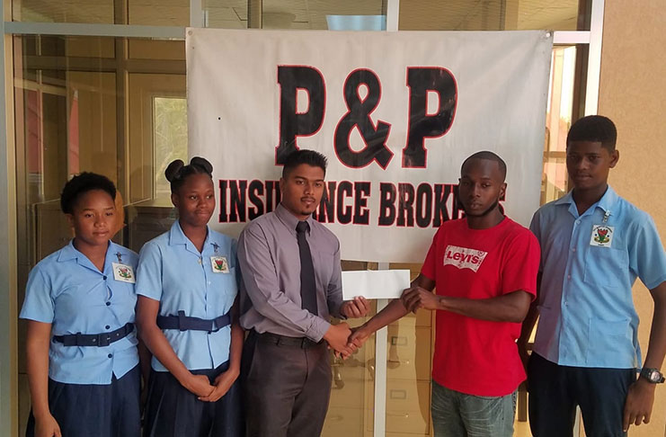 P&P Insurance Brokers representative hands over sponsorship to Brave Heart Football Club.