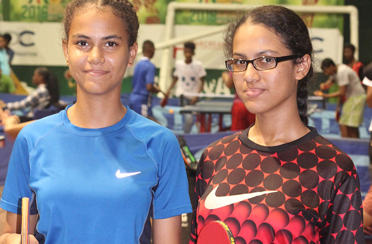 Sisters Crystal (left) and Nicky Melville played undefeated to lift Mae’s Schools to the Girls’ Novices team title.