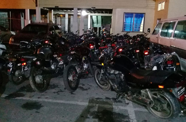 Some of the seized motorcycles in police custody