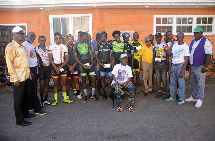 The overall winners of the Burnham Memorial Three-stage cycling road race pose along with members of the Burnham Foundation. (Samuel Maughn photo)