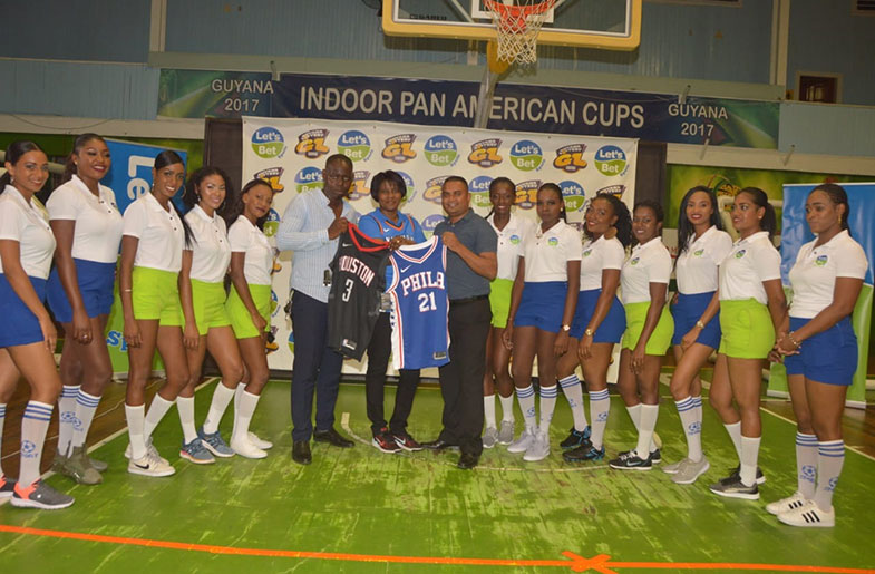 Winners of the NBA jerseys, Avinash Ramzan (right centre) and Kennard Copeland (left centre) pose with GLC General Manager Tracey Lewis (centre) and the Let’s Bet Sports models. (Adrian Narine photo)