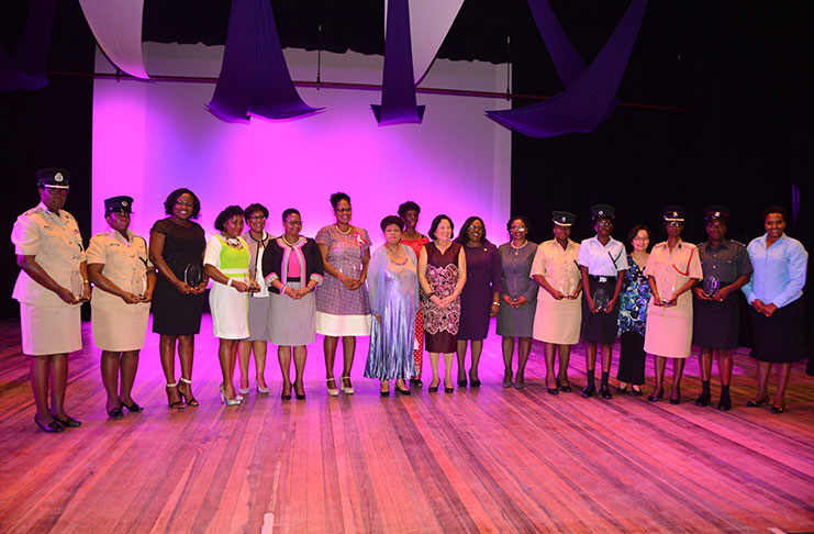 (center) First Lady Sandra Granger, Minister of Social Protection, Amna Ally posing with the awardees and other officials