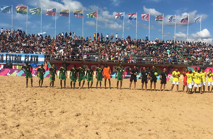 Guyana attired in green (at left) and their opponents Colombia (yellow and white) pose before the match.