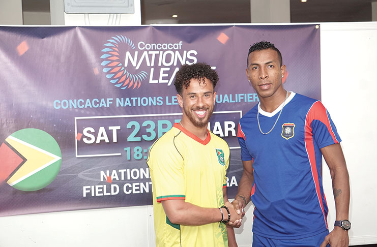 Golden Jaguars captain Sam Cox and Belize’s Woodrow West at a Press Conference at the Pegasus Hotel. (Carl Croker photo)