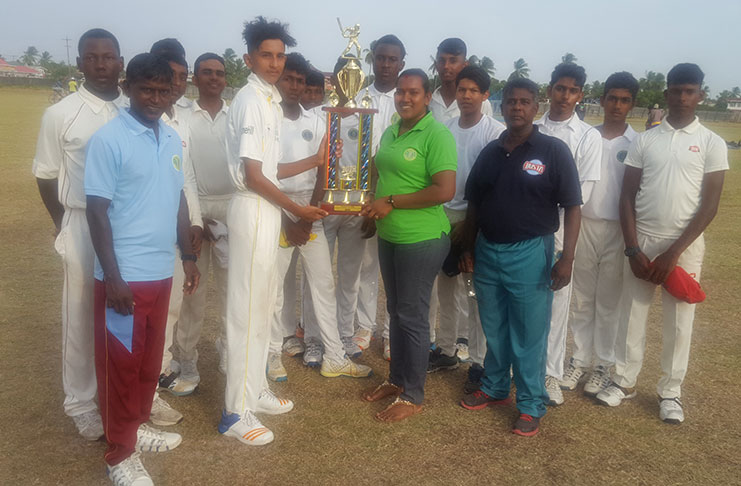 DCB’s administrator Kavita Yadram hands over the winning trophy to East Coast captain in presence of other teammates and management staff.