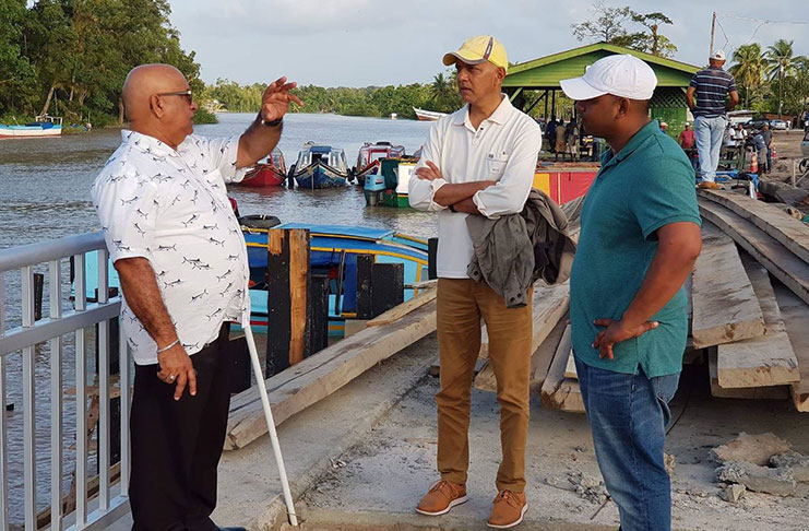 Minister of Communities Ronald Bulkan along with Regional Executive Officer Denis Jaikarran inspecting the Supenaam Waterfront Development Project