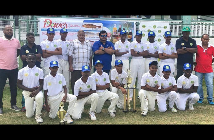 The 2019 U-15 Inter-County winners, Demerara, celebrate with the championship trophy.