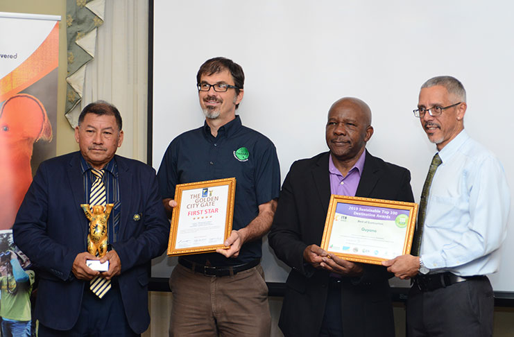 Minister of Indigenous Peoples’ Affairs Sydney Allicock; Director of the Guyana Tourism Authority, Brian Mullis; the Director General of Tourism Donald Sinclair and Minister of Business Dominic Gaskin holding the awards (Photo by Samuel Maughn)