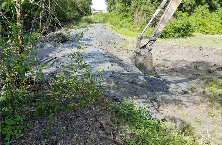 Excavator sealing the breach at Providence