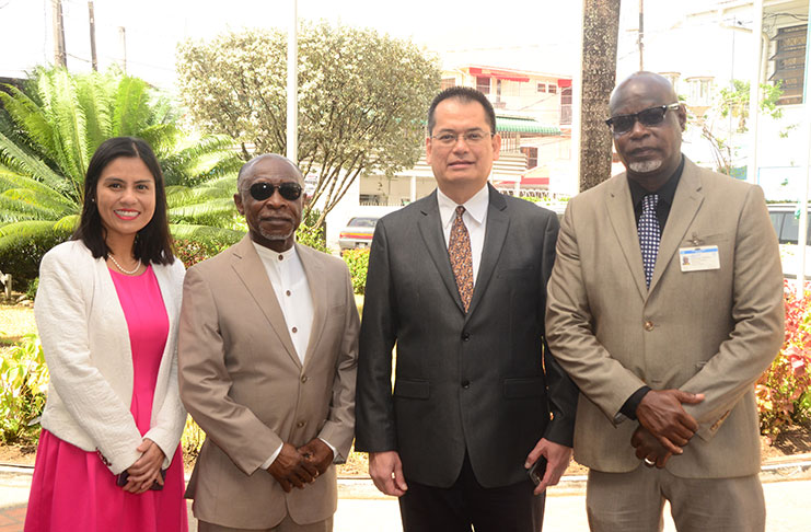 Acting President Carl Greenidge (second, left) opened the five-day workshop on Monday. With him, from left, are UNCTAD Facilitators Pamela Ugaz and Bismark Sitorus and UNCTAD Programme Manager Terence Leonard. (Adrian Narine photo)